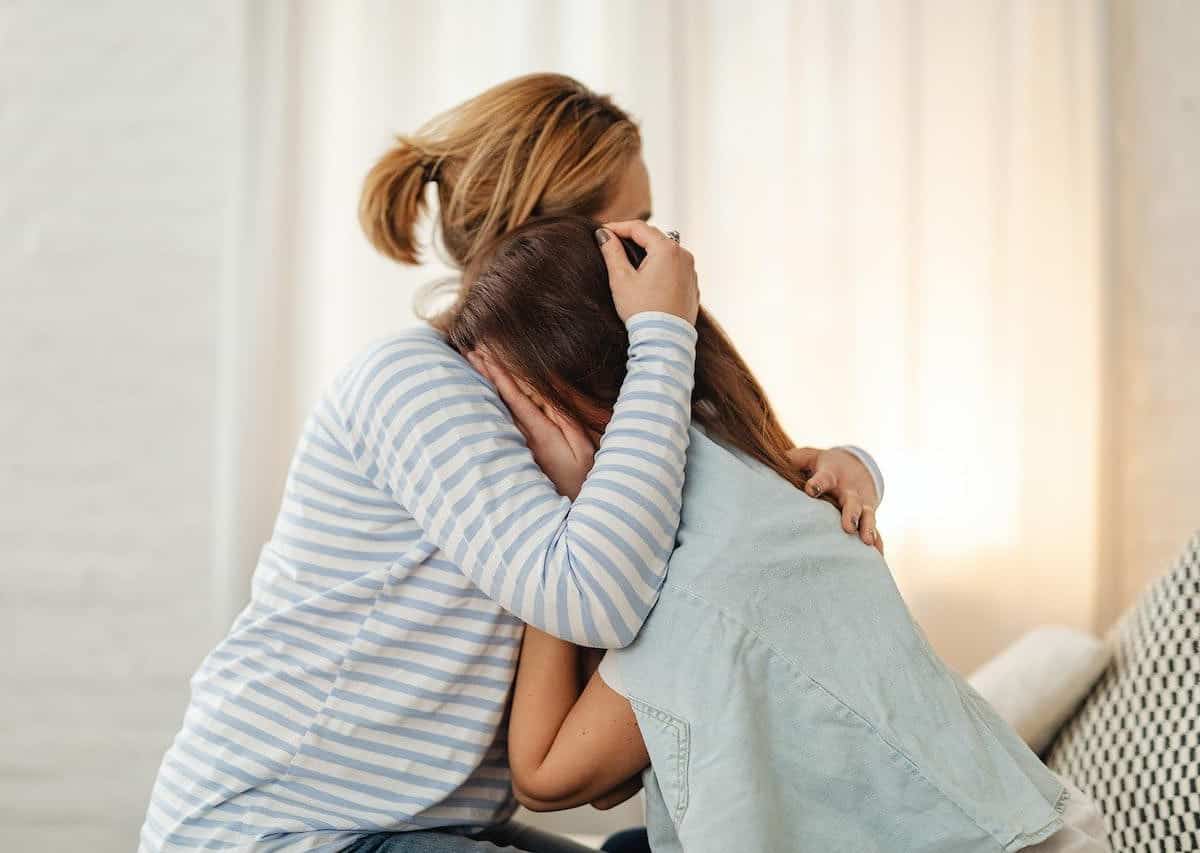 supporting a friend through a miscarriage with a hug