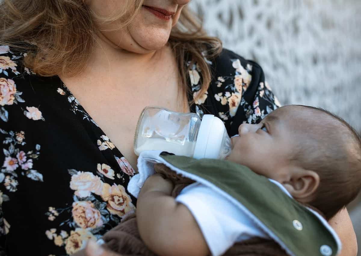 bottle feeding baby on the go